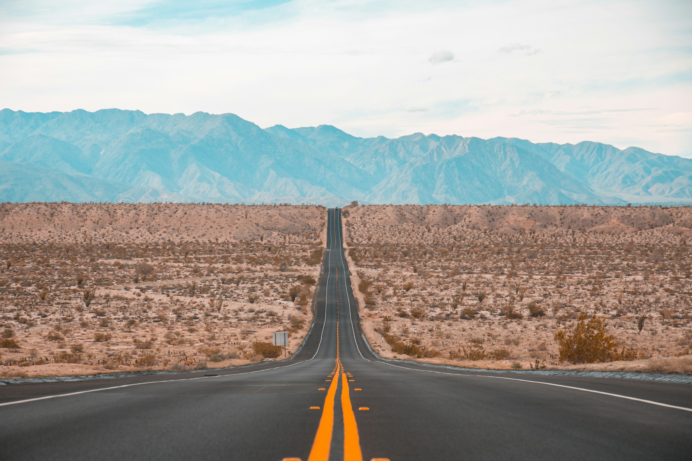 Long road representing sustainable progress and growth