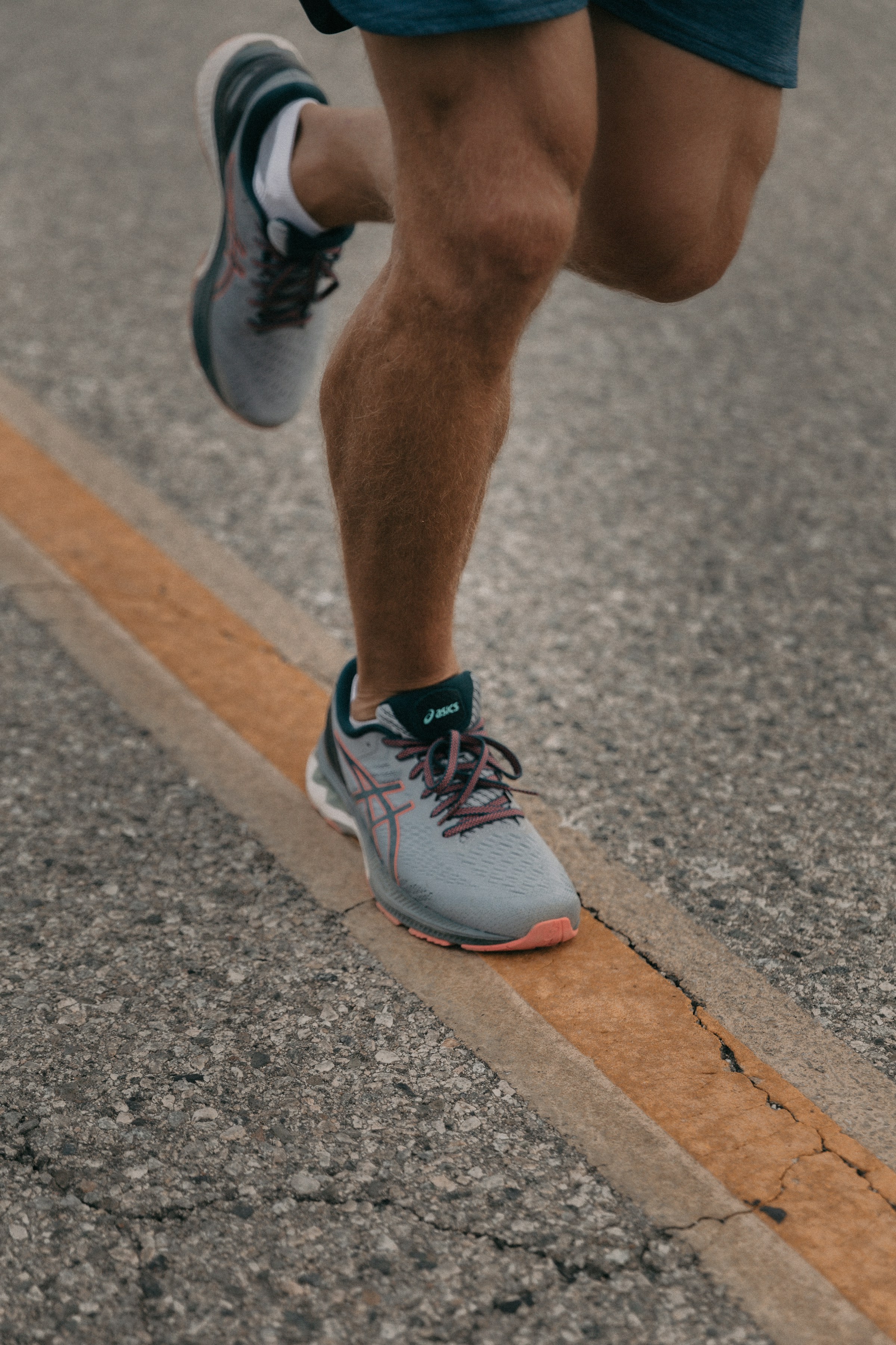 Runner training on an open road